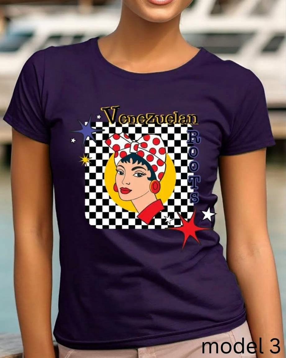 A woman wearing a dark purple short-sleeve t-shirt with a graphic print of a Venezuelan Rosie the Riveter-style illustration and the text 'Venezuelan Rosie'.