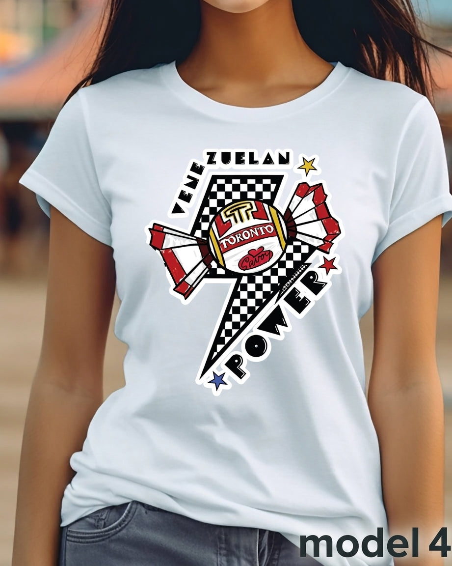 A woman wearing a white short-sleeve t-shirt with a large graphic print on the front. The graphic features a lightning bolt with a black and white checkered pattern, red and white wings, a football, and the text 'VEHICLE ZUELAN' and 'POWER'.